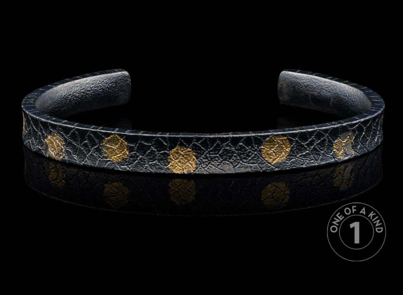 One of a kind cuff bracelet from William Henry featuring textured sterling silver and 23.5K Yellow gold